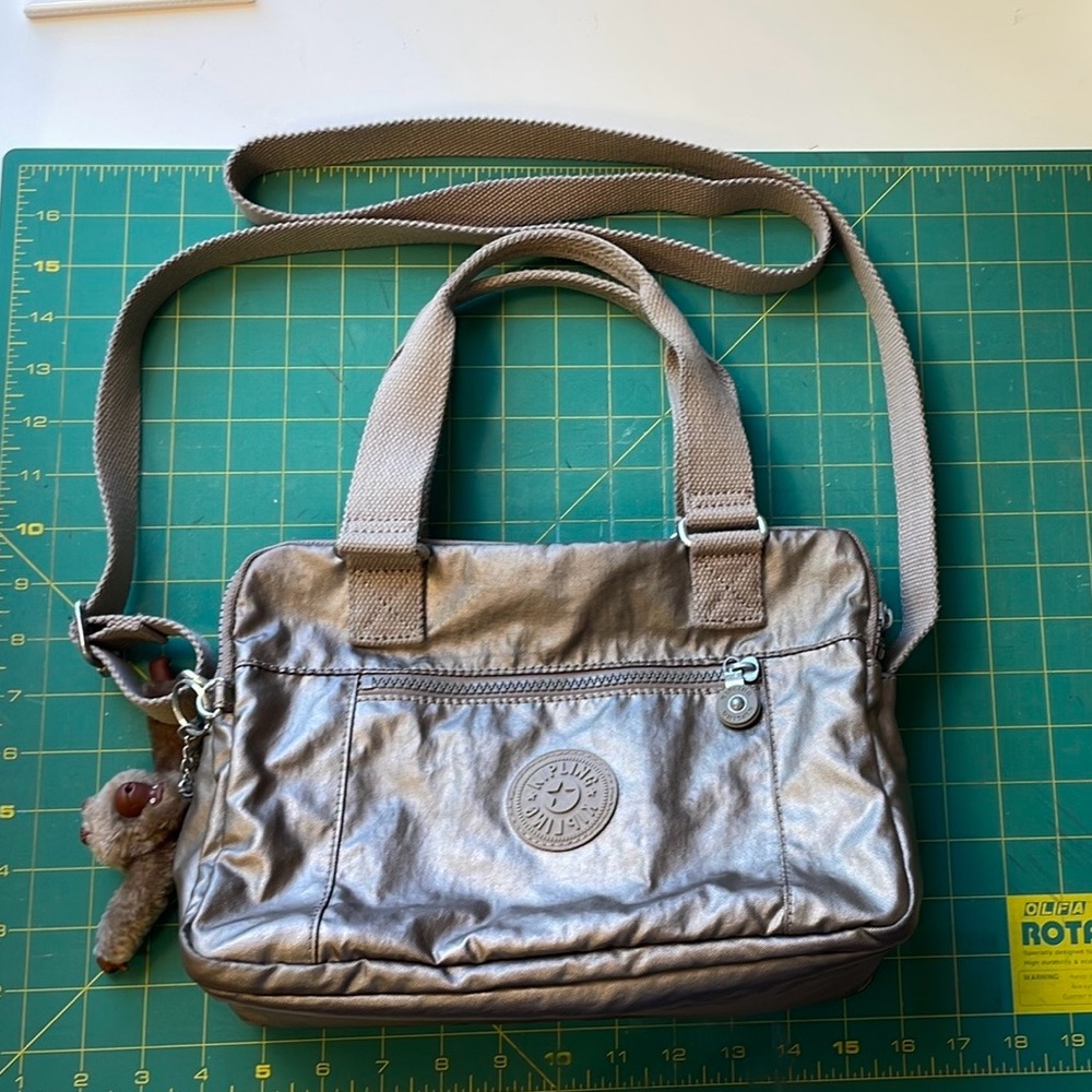 Kipling Gold Bent Crossbody Bag with Water-Resistant Finish and Money Key Chain